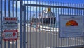 Port of Melbourne security gate with large tanker on the jetty