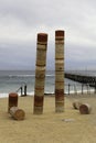 Port Noarlunga Beach with Jetty and Guildhouse art statue, ominent. Beach and Jetty in the Background. Royalty Free Stock Photo