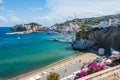 The port of the Ponza, Italy. Coloured houses, boats, ferry in the harbour of island of Ponza. People on a beach Dante Alighieri