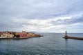 Port quay and historic lighthouse in the town of Chania on the island of Crete Royalty Free Stock Photo