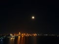 Port at night, full moon, river in one photos Royalty Free Stock Photo