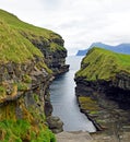 Port in a rock canyon in Gjogv Faroe