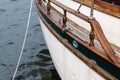 Port side of a vintage sailboat with mooring line, old ship rigging details Royalty Free Stock Photo