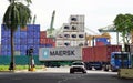 The Port of Singapore Authority (PSA) manages busy cargo container traffic at the port of Singapore
