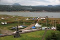 Port of small and large sailboats parked and sailing on the lake of Valle de Bravo in Mexico at sunset