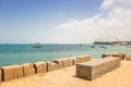 Port of Stone Town, Zanzibar. Harbor with ships with seaside embankment, Stone Town. Stone pier at the beach. Dock in Indian Ocean Royalty Free Stock Photo