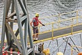 Port of Vancouver, WA, USA. August,21, 2020. Shore dockers work on the berth with ship ropes during the mooring operation of a bul