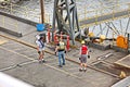 Port of Vancouver, WA, USA. August,21, 2020. Shore dockers work on the berth with ship ropes during the mooring operation of a bul