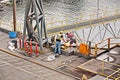 Port of Vancouver, WA, USA. August,21, 2020. Shore dockers work on the berth with ship ropes during the mooring operation of a bul