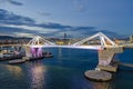 Port Vell with its bridge Porta d`Europa and the aerial tramway tower Torre Jaume I in Barcelona at night Royalty Free Stock Photo