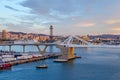 Port Vell with its bridge Porta d`Europa and the aerial tramway tower Torre Jaume I in Barcelona