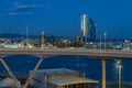 Port Vell with its cruise terminal, bridge Porta d`Europa, Nautic Center and W Barcelona at night Royalty Free Stock Photo
