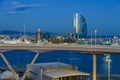 Port Vell with its cruise terminal, bridge Porta d`Europa, Nautic Center and W Barcelona at night Royalty Free Stock Photo