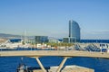 Port Vell with its cruise terminal, bridge Porta d`Europa, Nautic Center and W Barcelona Royalty Free Stock Photo