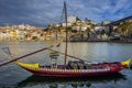 Port wine boat on a bank of Douro River in Vila Nova de Gaia city Royalty Free Stock Photo