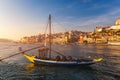 Port wine boats at the waterfront with the old town on the Douro River in Ribeira in the city centre of Porto in Porugal, Europe. Royalty Free Stock Photo