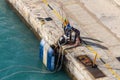 Port workers on mooring rope in Barbados