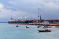 Port of Zanzibar with big ships, cranes and cargos near the quay in Stone Town, Zanzibar, Tanzania Royalty Free Stock Photo