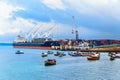 Port of Zanzibar with big ships, cranes and cargos near the quay in Stone Town, Zanzibar, Tanzania Royalty Free Stock Photo