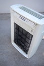 Portable air purifier with dirty carbon filter. Cleaning time