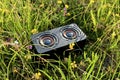 Portable audio speaker in the grass