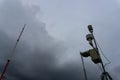 Portable Automatic Weather Station at Ngurah Rai airport under the scary dark Cumulonimbus clouds. This tool has a function to Royalty Free Stock Photo