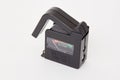 Portable battery tester on white Royalty Free Stock Photo