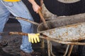 Worker is taking sand from wheelbarrow Royalty Free Stock Photo