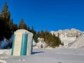Portable chemical toilet in snow in Swiss Alps. Royalty Free Stock Photo