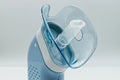 Portable compressor nebulizer with inhaler tool. Close-up. Medical equipment for inhalation therapy.