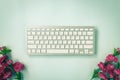 Portable Computer Keyboard and Rose Flower at Bottom in Vintage Tone Royalty Free Stock Photo