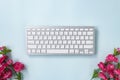 Portable Computer Keyboard and Rose Flower at Bottom Royalty Free Stock Photo