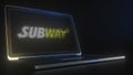 Portable computer with the logo of SUBWAY made with code strings, editorial conceptual 3d rendering
