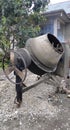 Portable concrete mixer mixes cement with sand, gravel and water