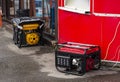 Portable electric generator running in the cold winter.Energy genocide. Power outage as a result of missile strikes by Russia on Royalty Free Stock Photo