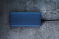 Portable External Battery Power Bank blue with USB Cord Royalty Free Stock Photo