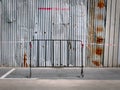 Portable Fence In Front of Corrugated Zinc Wall Around Construction Site Royalty Free Stock Photo