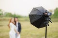portable flash light setup with reflector modifier for portrait lighting outdoor photography Royalty Free Stock Photo