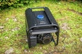 Portable gasoline generator in the open air. Royalty Free Stock Photo