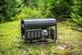 Portable gasoline generator in the open air. Royalty Free Stock Photo