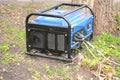 Portable Generator - Outdoor Power Equipment. Mobile backup power generator in the garden Royalty Free Stock Photo