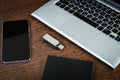 A portable hdd connected to a laptop with usb flash drive and smartphone Royalty Free Stock Photo