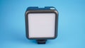 Portable LED Light for Camera on blue background Royalty Free Stock Photo