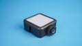 Portable LED Light for Camera on blue background Royalty Free Stock Photo