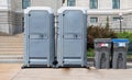 Portable mobile toilets and trash for recycle in the park. A line of chemical WC cabins for a festival event Royalty Free Stock Photo