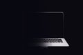 Portable modern silver computer on a black background. Royalty Free Stock Photo