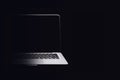 Portable modern silver computer on a black background. Royalty Free Stock Photo