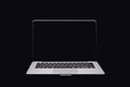 Portable modern silver computer on a black background. Royalty Free Stock Photo