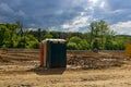 Portable outdoor restroom is located at a construction site project