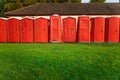 Portable plastic red toilets in a park - mobile sanitary system
